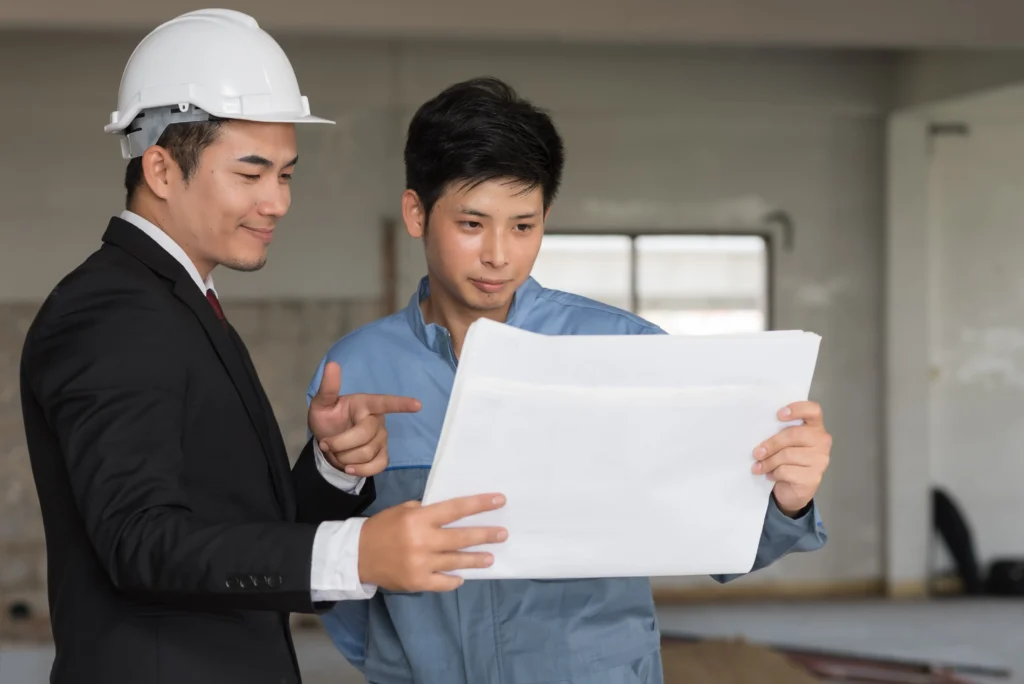 businessman-smiling-with-engineer-looking-blueprint-construction-site_11zon,ตรวจบ้าน,ตรวจบ้านก่อนโอน,ตรวจคอนโด,ตรวจสำนักงาน,ก่อนโอน,รับตรวจบ้านก่อนโอน,บริษัทรับตรวจบ้าน,ตรวจรับบ้านก่อนโอน,การตรวจบ้านก่อนโอน,การตรวจรับบ้านก่อนโอน,การตรวจรับบ้าน, inspector, S Inspector,วิศวกรตรวจบ้าน,วิศวกร,ผู้ตรวจอาคาร